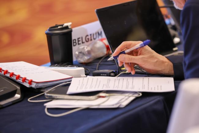 A delegate takes notes