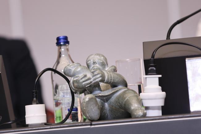 Inuit mother and child soapstone statue that traditionally resides on the Stockholm Convention dais
