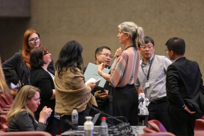 Delegates huddle
