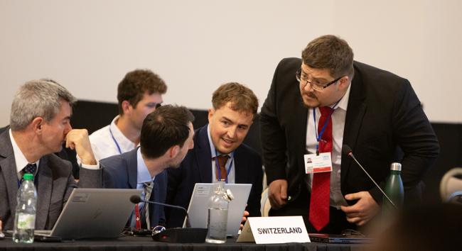 Mathieu Ortega, UK confering with delegates from Switzerland - OEWG32 - 15Jun2025