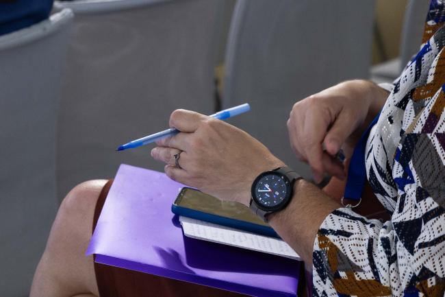 Delegate takes notes