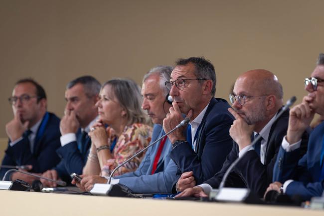 Delegates listen to the interventions