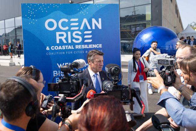 Christian Estrosi, Mayor of Nice, and President, Ocean Rise and Coastal Resilience Coalition, conducts an interview with the press