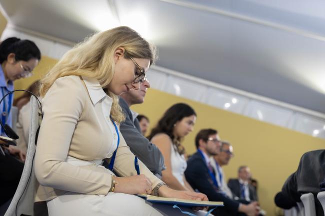 Participants take notes during the session