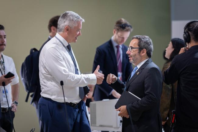 Mathias Cormann, Secretary-General, OECD, speaks with Jorge Moreira da Silva, Executive Director, UNOPS