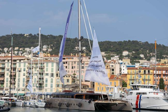 As part of the Art Explora Festival, the museum boat is docked in the harbour for the Third UN Ocean Conference, with the sail displaying 'here we dream of no more front tears'