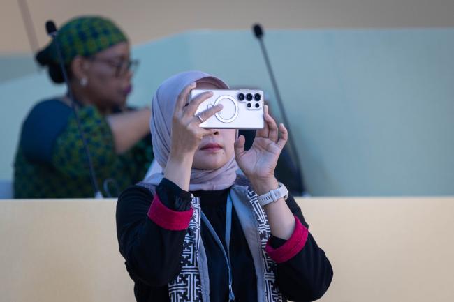 Delegate takes photo