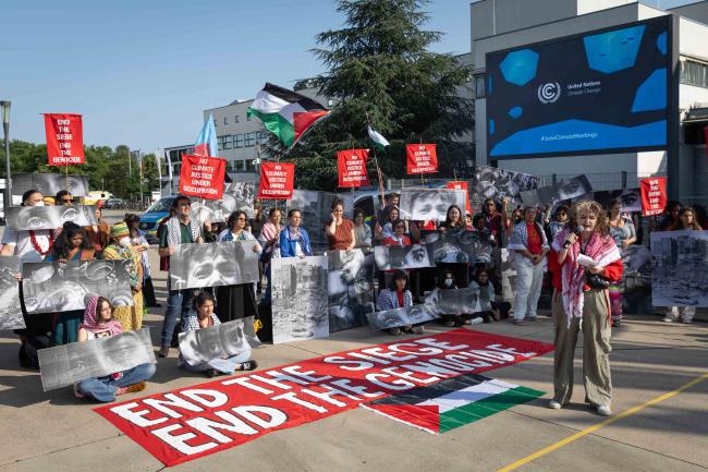 As delegates arrive for the first day of SB 62, members of civil society demonstrate outside, saying there is 'no climate justice under occupation'