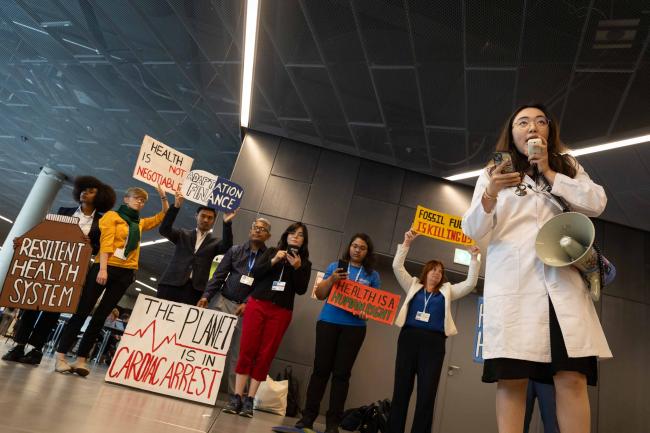 The International Federation of Medical Students’ Associations (IFMSA) demonstrate, saying 'code blue - the climate crisis is a health crisis'