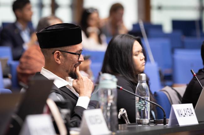 Delegates listen to the discussions