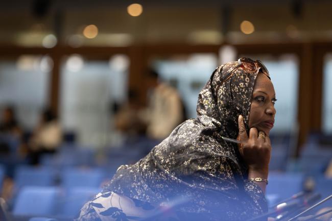 A delegate listens to the discussions during the ACE Dialogue world café