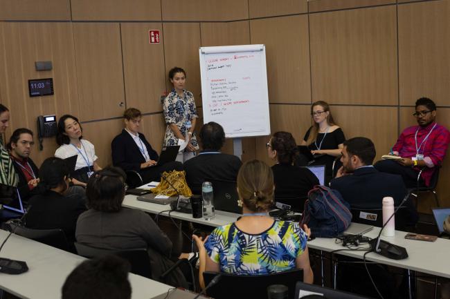 Delegates break out into groups for more in-depth discussions