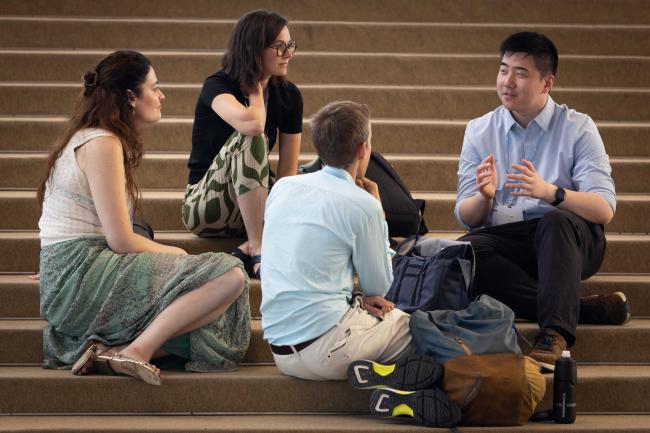 Delegates meet informally between sessions