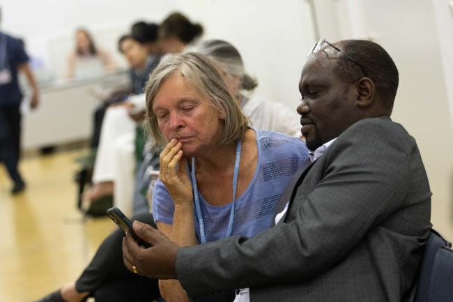 Delegates interact on the platform