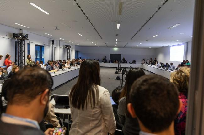 As the time goes well past 9:00pm, delegates meet informally to continue negotiations on the GGA