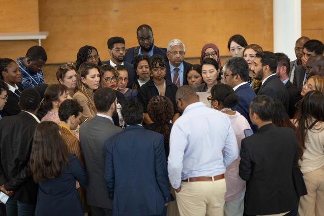 Members of the G-77/China huddle to find a way forward on the Global Goal on Adaptation (GGA)