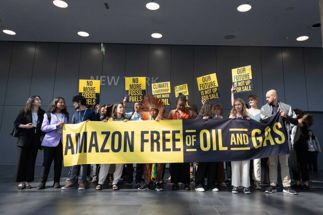 Members of civil society demonstrate in the corridors, reminding delegates that there should be no oil and gas projects in the Amazon