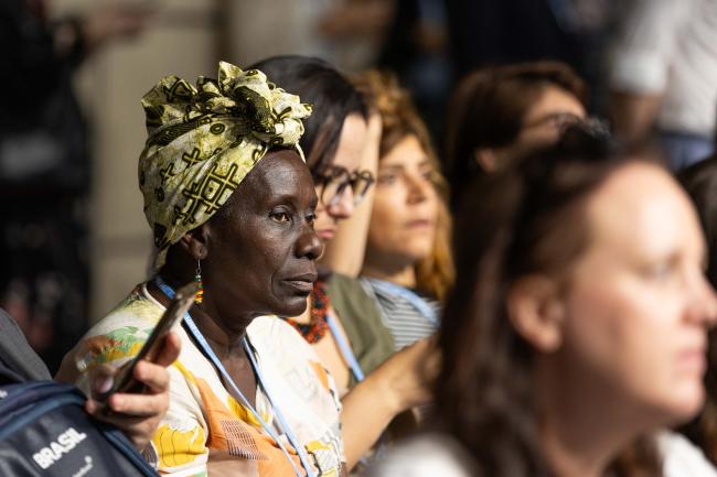 Delegates listen to the interventions