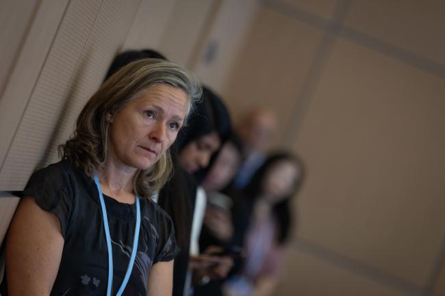 Delegates listen to discussions throughout the day