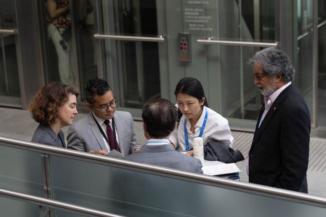 Kishan Kumarsingh, Trinidad and Tobago, and Patrick Spicer, Canada, Co-Facilitators for matters relating to the Global Stocktake, speak with the UNFCCC Secretariat