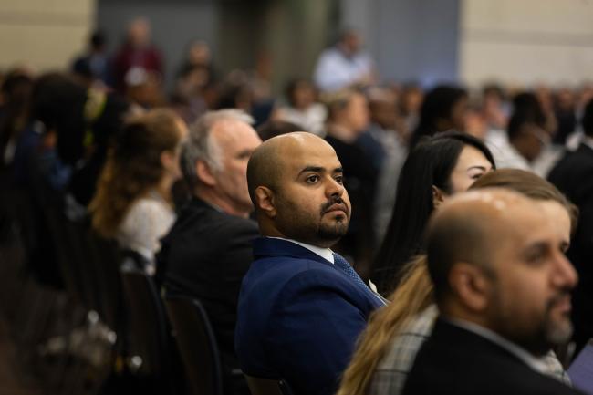 Delegates listen to discussions during informal consultations on the just transition