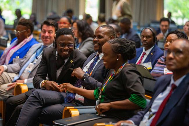 Delegates share a light moment_AMCEN20_16Jul25_photo.jpg
