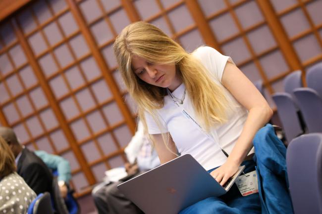 A delegate takes notes 