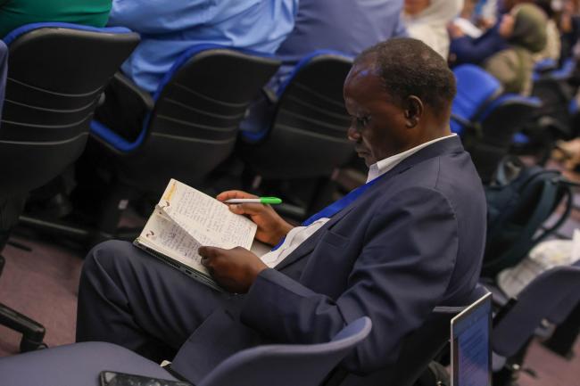 Delegates take notes 