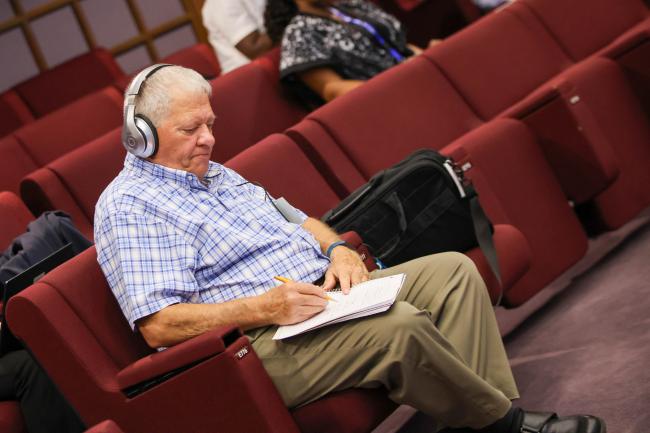 Delegates take notes