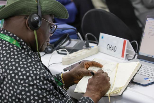 A delegate takes notes 