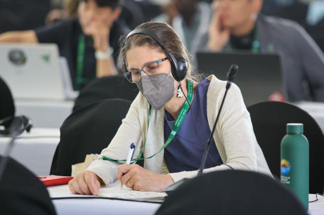 A delegate takes notes 
