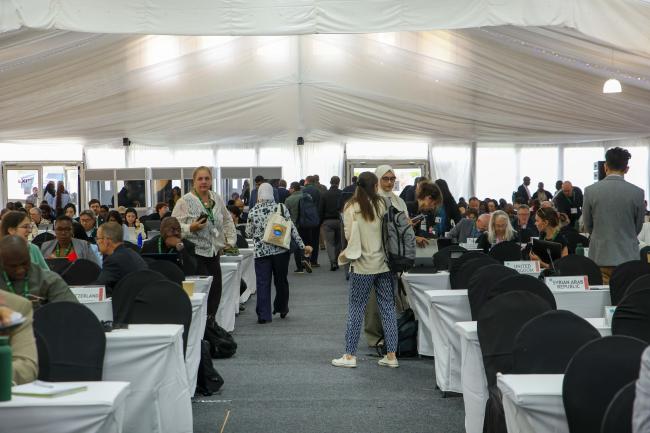 Delegates leave the room to continue the negotiations at contact groups. 