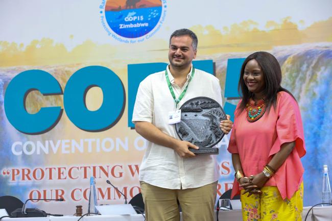 Iman Ebrahimi, Iran, and Musonda Mumba, Secretary General, Convention on Wetlands 