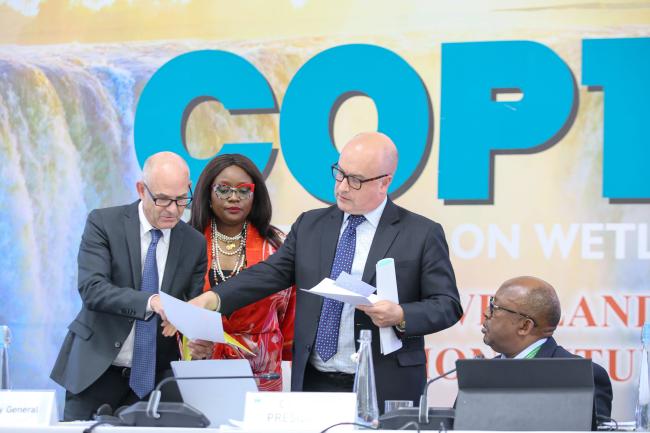 Jay Aldous, Deputy Secretary General, Convention on Wetlands, and Musonda Mumba, Secretary General, Convention on Wetlands consult with Stadler Trengove, Legal Advisor 