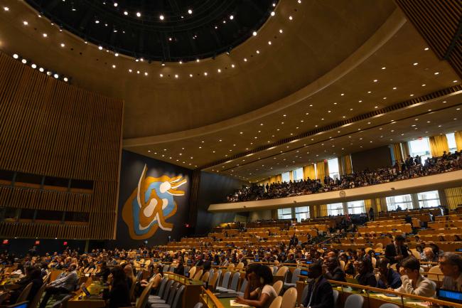 Delegates gather in the UN General Assembly hall at the beginning of the day
