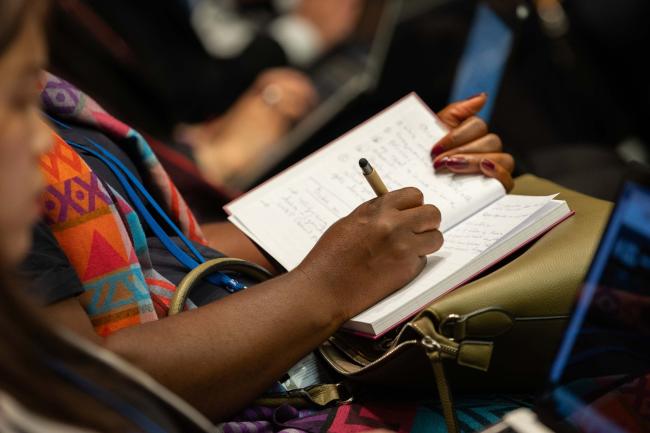 Delegate takes notes