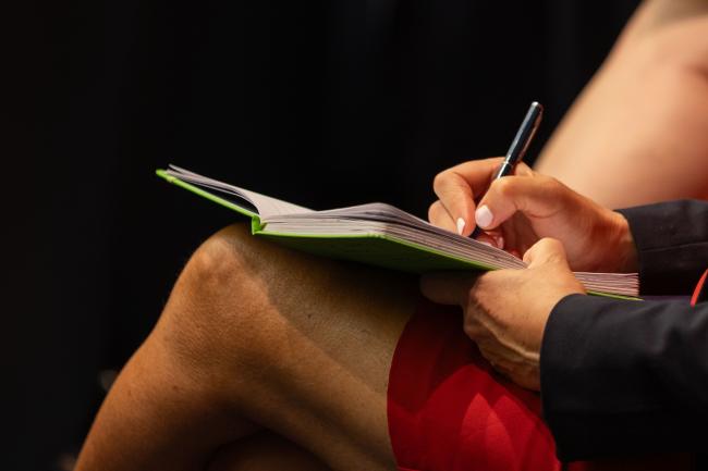 Delegate takes notes