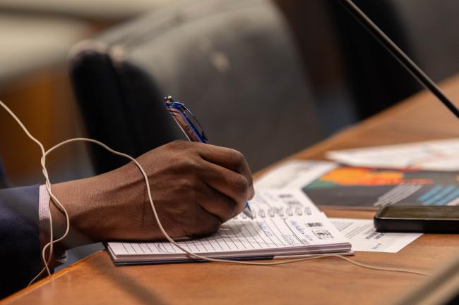 Delegate takes notes