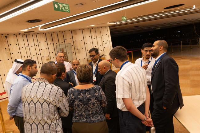 Delegates from the Like-Minded Countries huddle in the corridors