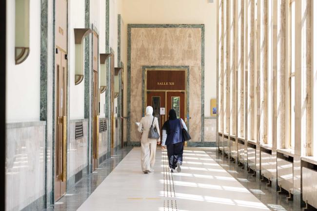 Delegates walk between buildings to attend the different informal meetings