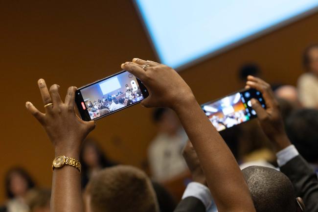 Delegates take photos