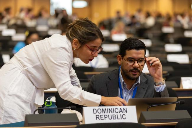 Delegates read the text