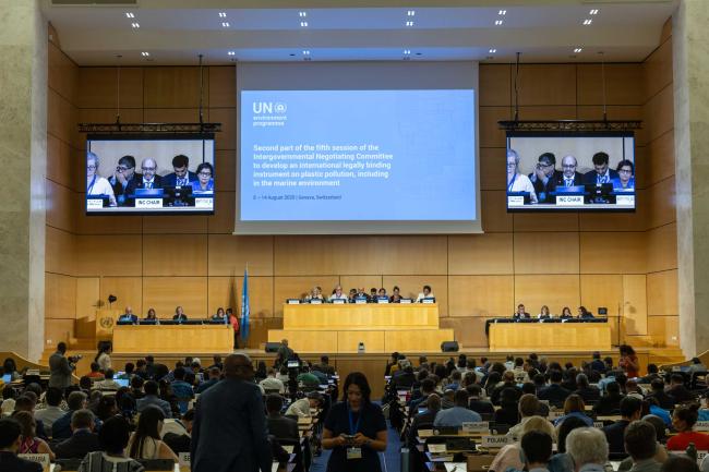 Delegates gather in plenary to discuss the latest version of text