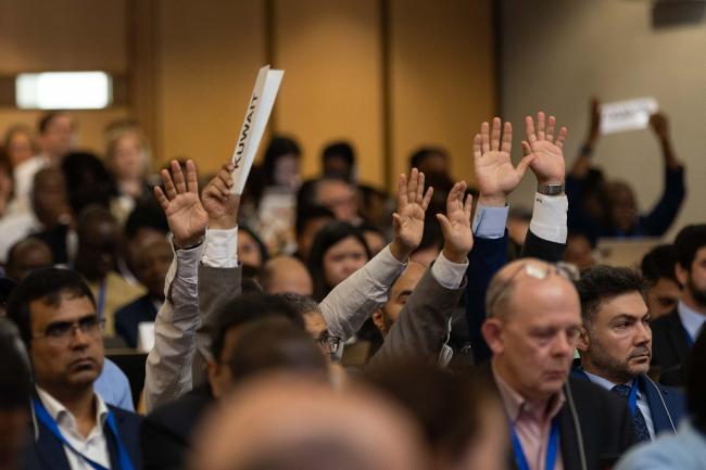 As the new text is introduced, a large number of delegations raise points of order