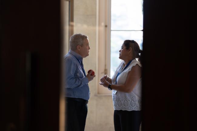 Delegates from Cuba consult in the corridors