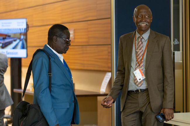 Oliver Boachie, Ghana, speaks with Santos Virgilio, Angola