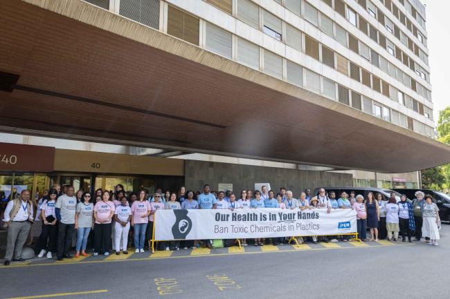 Representatives of the International Pollutants Elimination Network (IPEN) demonstrate outside the venue, highlighting the negative impacts plastic pollution has on human health, and saying 'our health is in your hands'