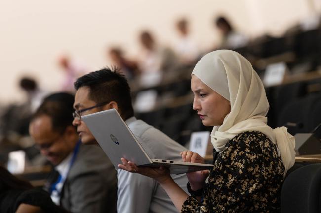 Delegates read the text