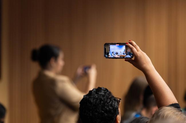 Delegates take photos