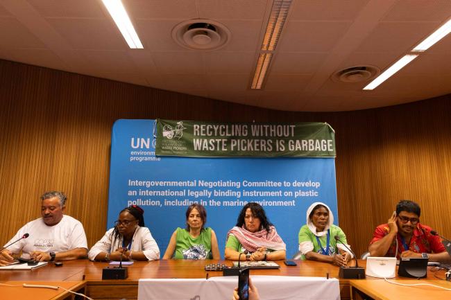 A press conference is held by the International Alliance of Waste Pickers, urging for the plastics treaty to include a binding commitment to a just transition for waste pickers